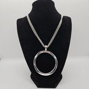 silver tone two chain necklace with large open circle pendant
